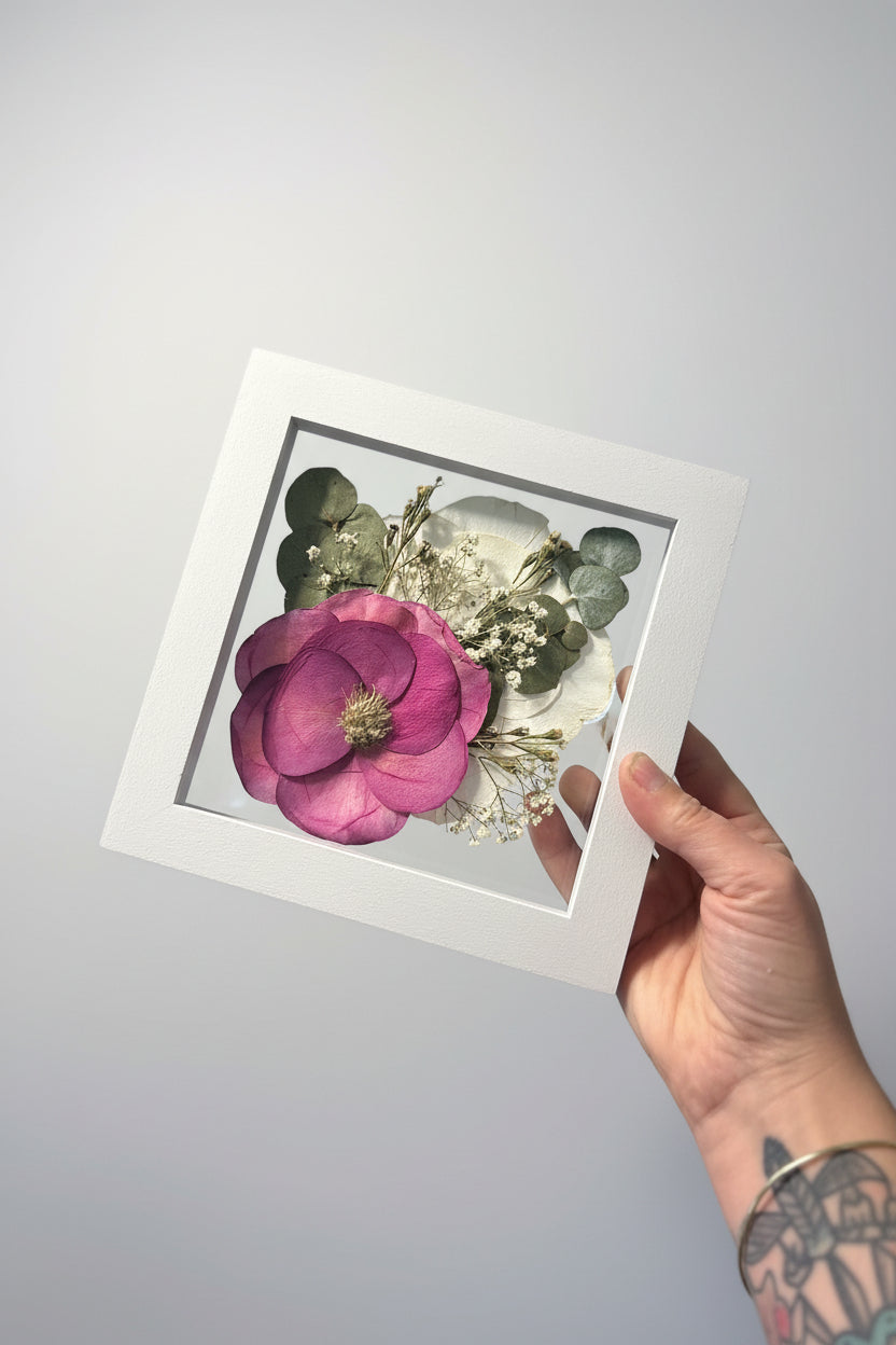 small white frame with pink and white flowers