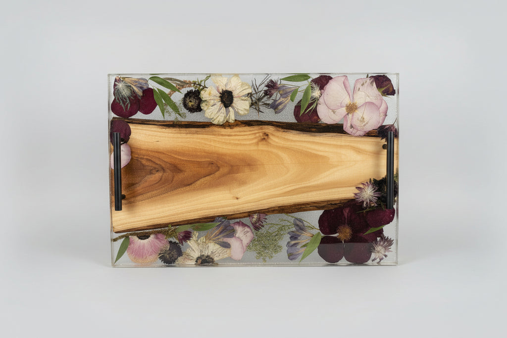 Wooden tray with floral design on a white background