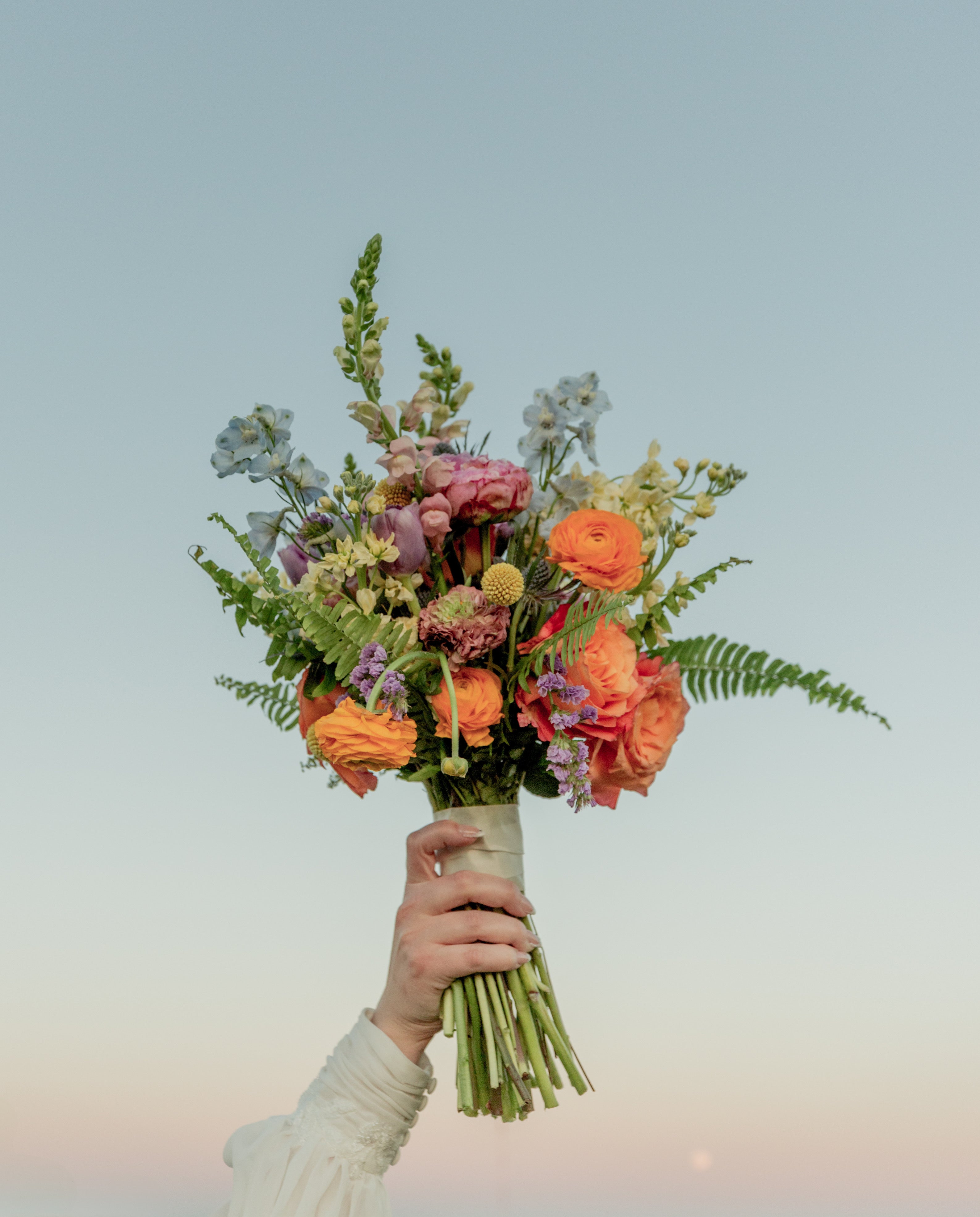 hand holding Bridal Bouquet