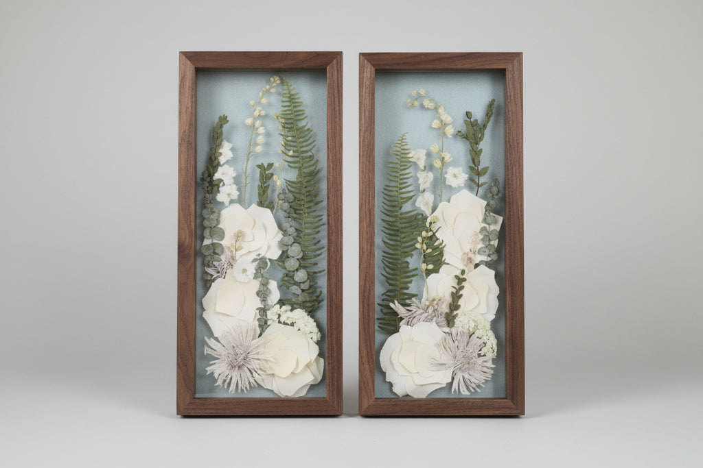 2 wood frames with white flowers inside