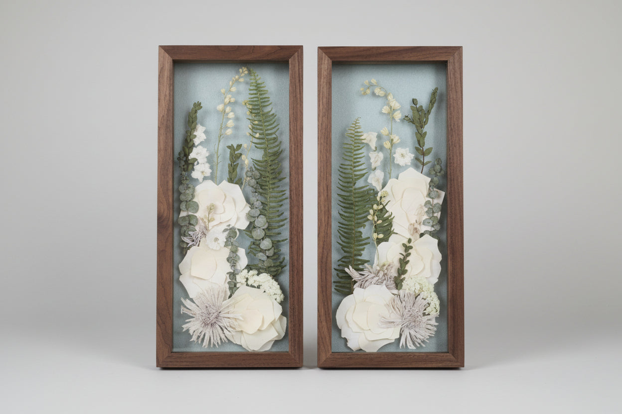 2 wood frames with white flowers inside