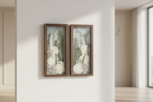2 wood frames with white flowers inside