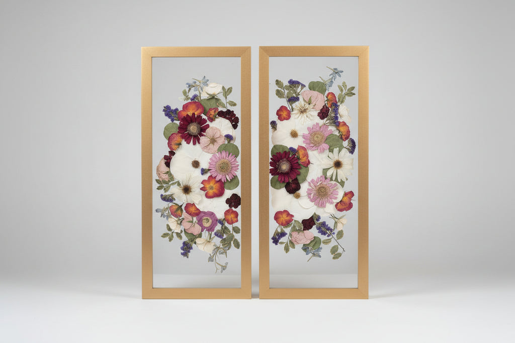 2 wood frames with colorful flowers inside