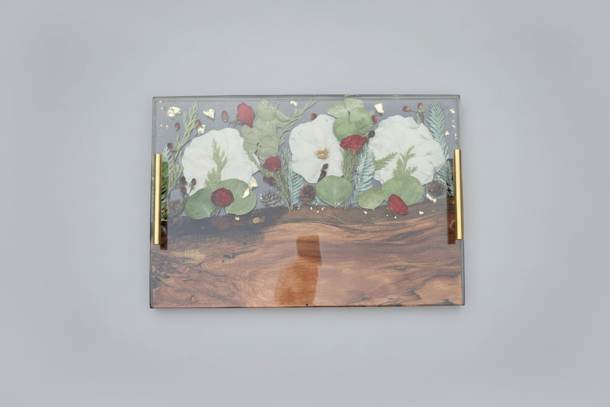 Decorative wooden tray with floral design on a dark background