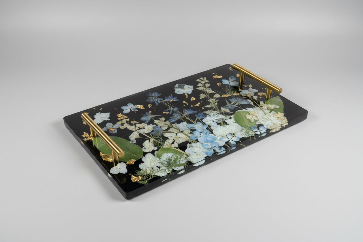Decorative tray with floral design and gold accents on a gray background