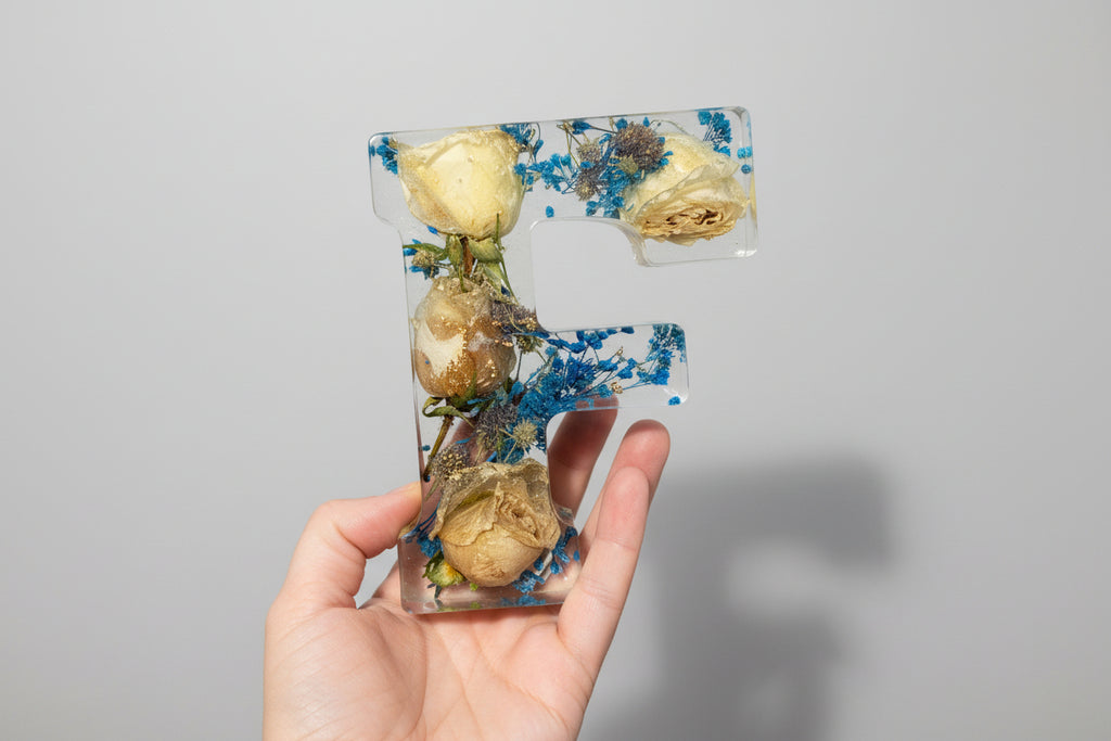 Resin Letter F in hand