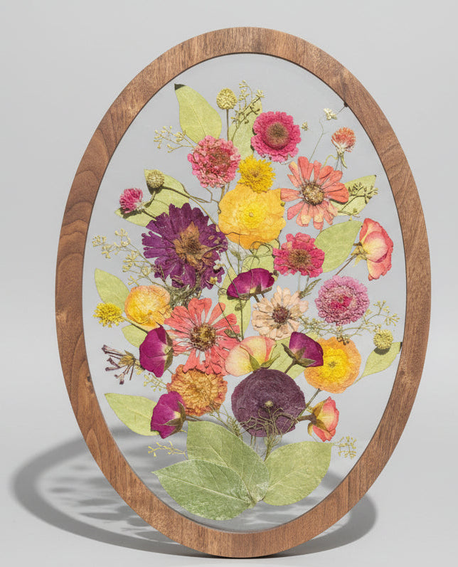 oval shape wood frame with colorful flowers inside