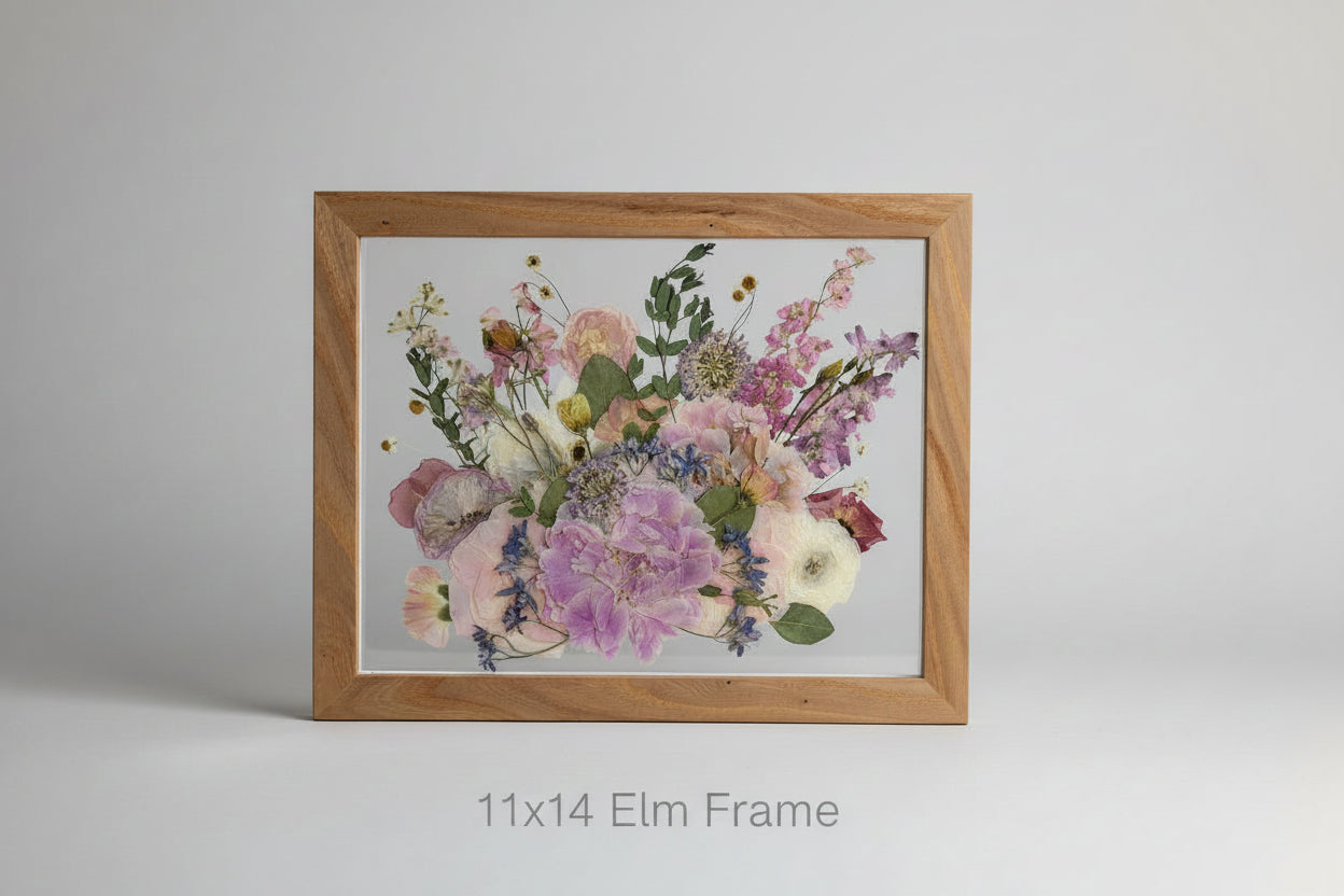 Framed floral artwork on a gray background