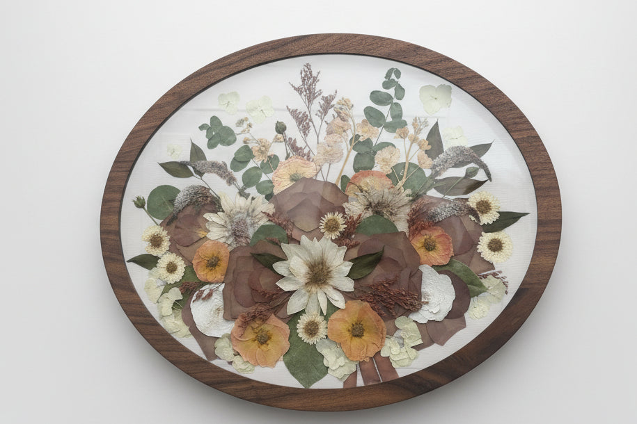 Oval Brown Wooden frame with flowers inside
