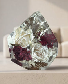 Gemstone resin shape with white and red roses inside with beige background
