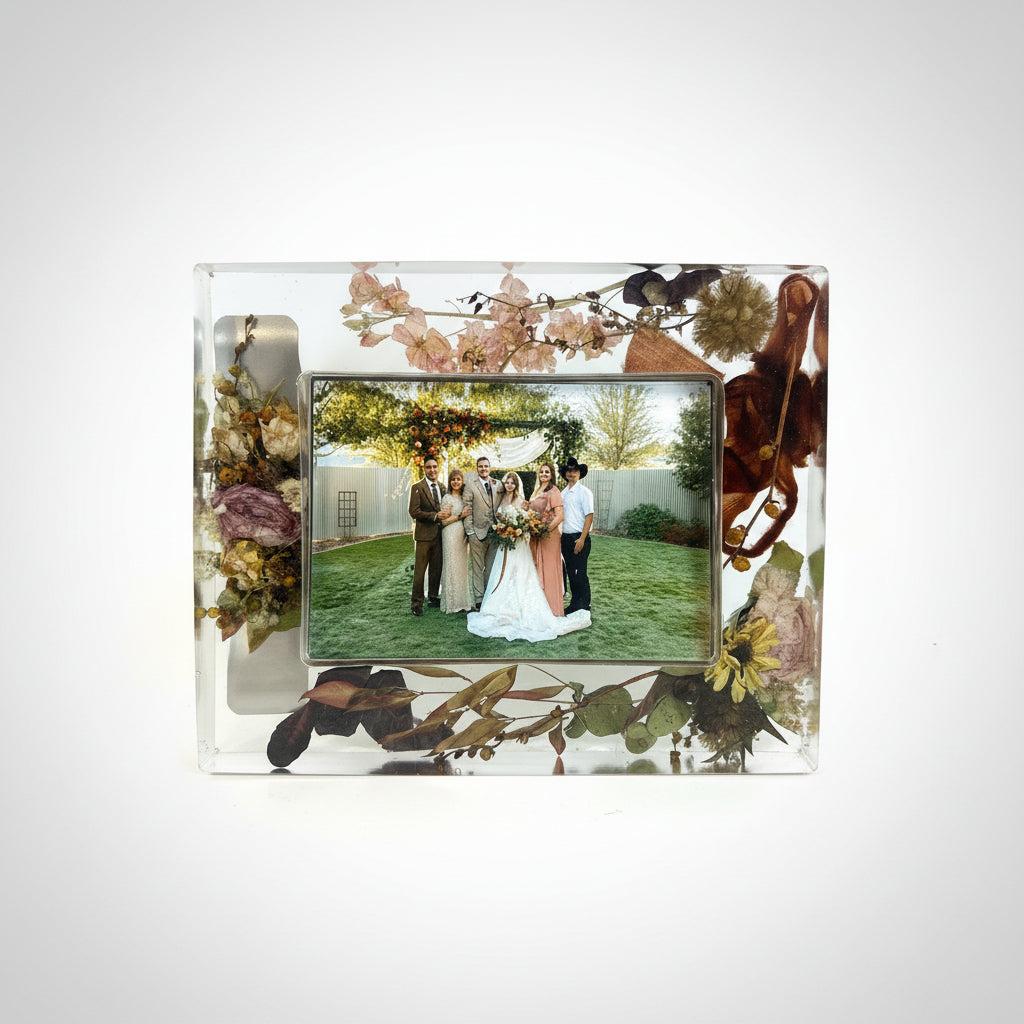 Resin photo frame with flowers inside and picture of family at wedding
