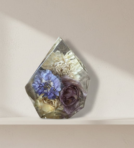 Resin gemstone shape with purple and white flowers inside