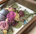 Wood shadowbox with flowers and charm inside
