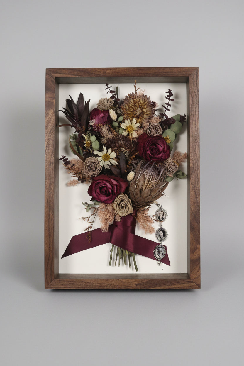 walnut shadowbox with maroon and dried floral inside
