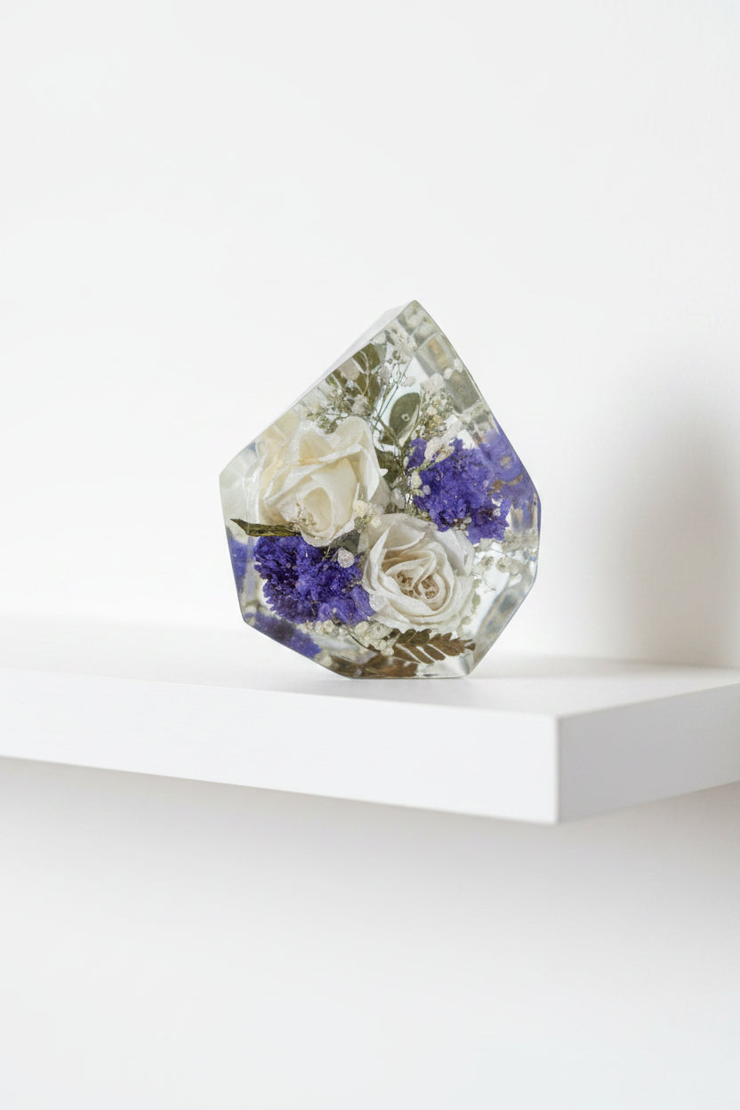 Gemstone resin shape with white and red roses inside with beige background