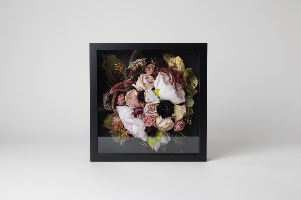 Framed bouquet of flowers with a black border