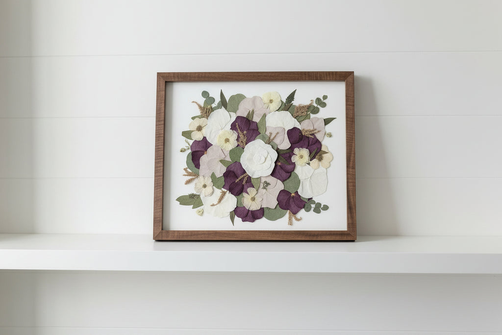 Framed floral artwork in studio with grey background