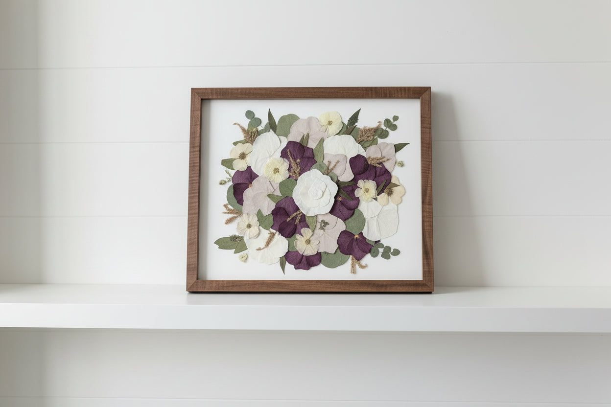 Framed floral artwork in studio with grey background