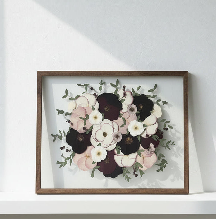 Framed floral artwork on a plain wall