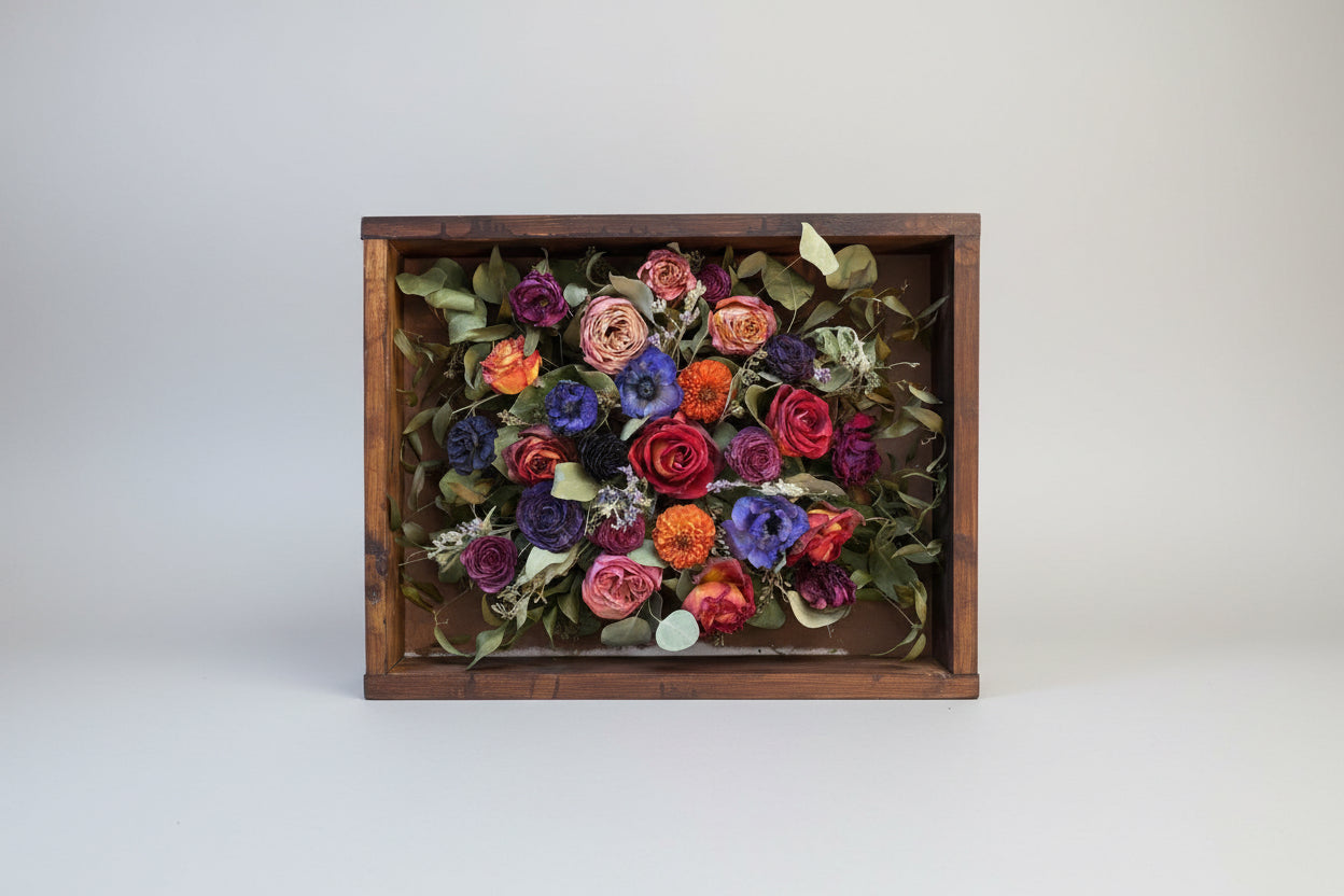Colorful bouquet of flowers in a wooden box