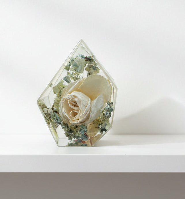 resin gemstone with white rose and blue hydrangea inside